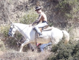 Justin Bieber can wear a fancy hat and no shirt while riding a horse but this is not something that should be attempted by non celebrity horseback riders.